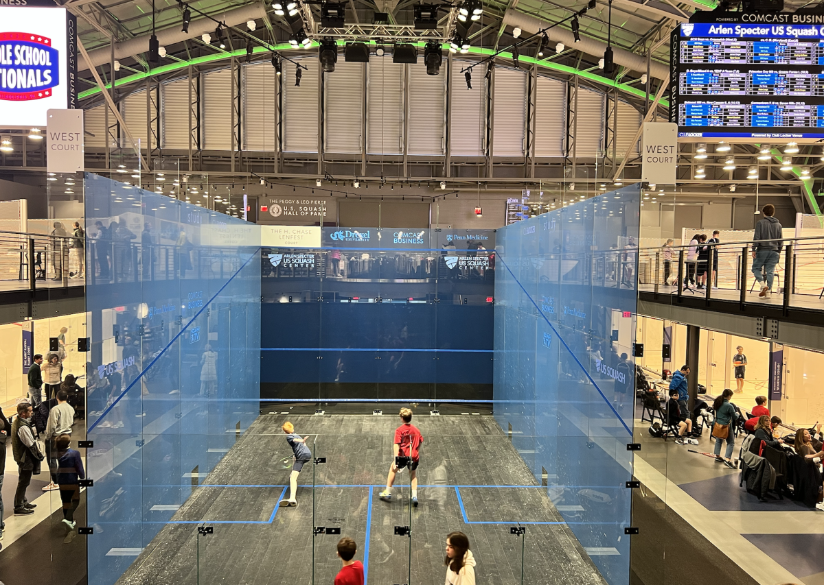 Brady Grieve '27 (left, and author) competes at US Squash Nationals 2022